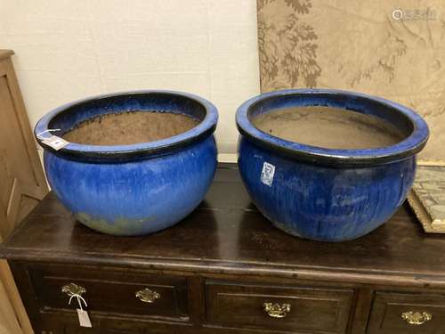 A pair of circular blue glazed garden planters, diameter 52cm, height 30cm