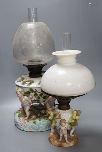 A Sitzendorf porcelain oil lamp and another similar smaller oil lamp, tallest 54cm including