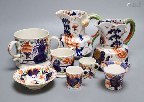 Eight pieces of Ironstone china including two jugs and a three handled cider mugCONDITION: One