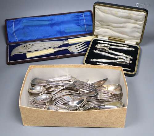 A pair of plated engraved bone handled fish servers, cased and a set of nut crackers, cased and