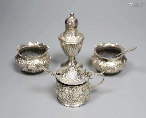 A pair of late Victorian embossed silver salts and one salt spoon, Charles Edwards, London, 1893,