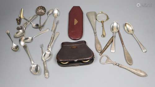 A group of silver spoons and implements, together with a pair of folding opera glasses