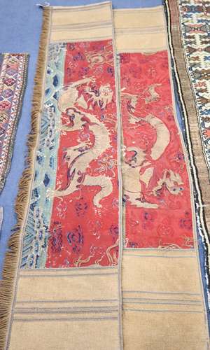 A pair of Antique Chinese silk and gold threadwork panels depicting dragons over waves, 38 x 150cm