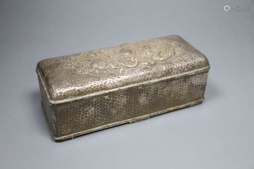 A Chinese planished silver casket, c.1900, with twin dragon decoration and divided interior, marks