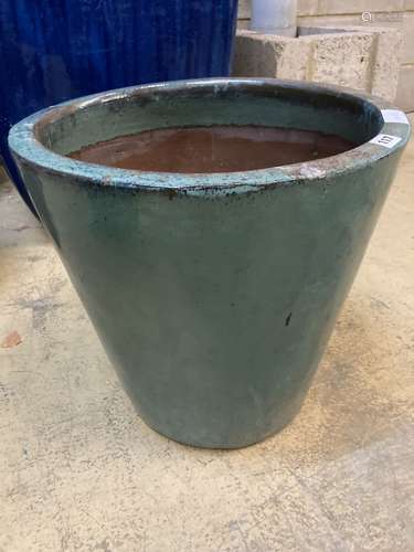 A circular green glazed garden planter, 46cm diameter, height 46cm