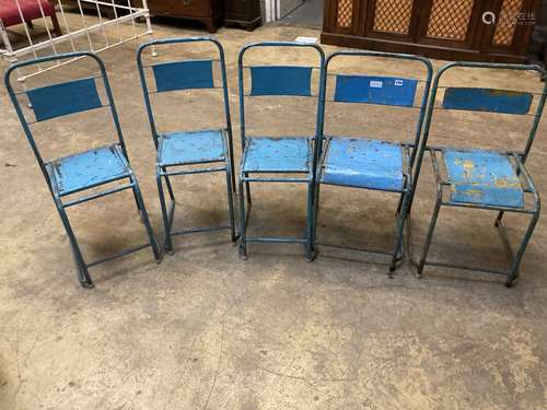 Four painted metal stacking chairs