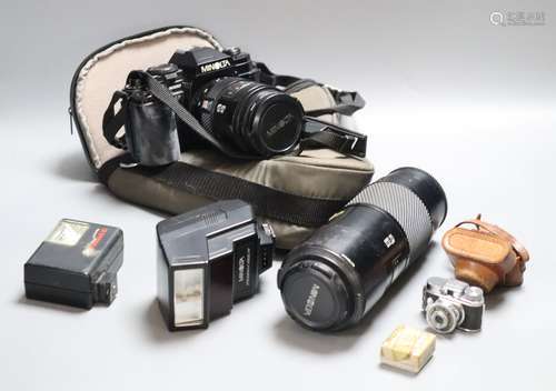 A Minolta 9000 SRL camera, a Minolta 75-300 zoom lens, with flash, together with a Sanwa Mycro