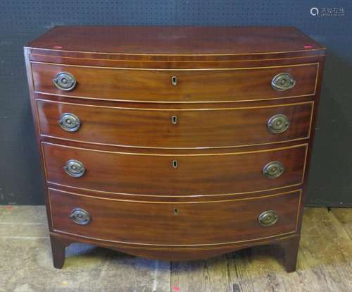An Early 19th Century Mahogany and Satinwood Strung Bow Fronted Chest of Four Long Drawers, 91cm