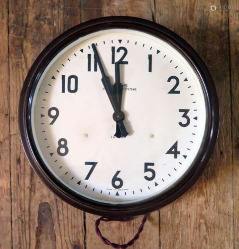 A SMITHS Bakelite Cased Electric Wall Clock with 9