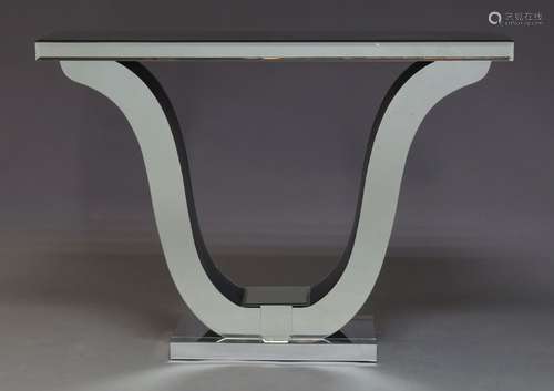 A mirrored console table, of recent manufacture, with rectangular top on lyre form support, raised