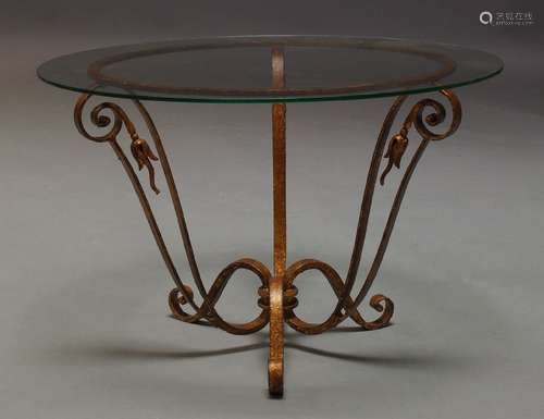 A French gilt metal occasional table, second half 20th century, with circular glass top on scrolling