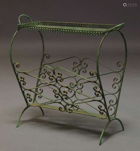 A French magazine stand, c.1950, with pierced tray top on shaped metal rod end supports, joined by