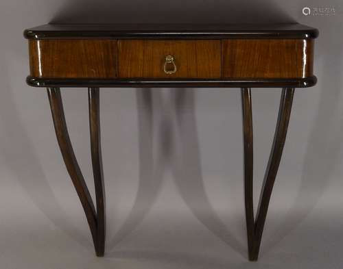 Italian, a walnut and ebonised wall mounted console table, c.1940, the rounded rectangular top