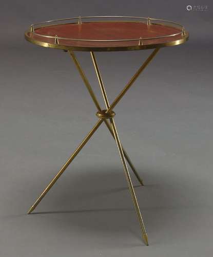 An Italian gilt metal side table, c.1950, with circular wood effect laminate top, on tripod legs,