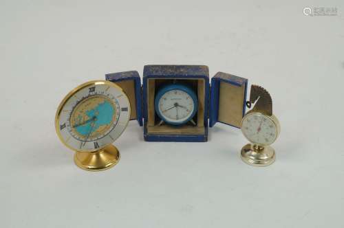 A group of early 20th century and later desk and travelling clocks, to include a world clock, the
