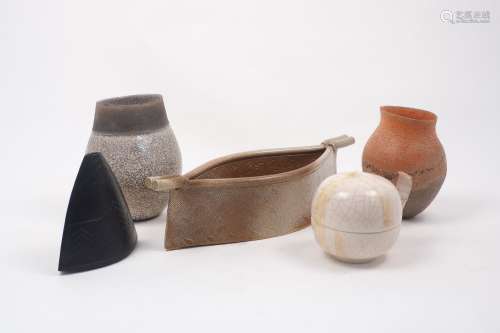 Jackie Breet, a porcelain triangular section vase with matt black glaze and geometric linear