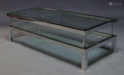 In the manner of Maison Jansen, a chromed and glass coffee table, c.1970, with rectangular sliding