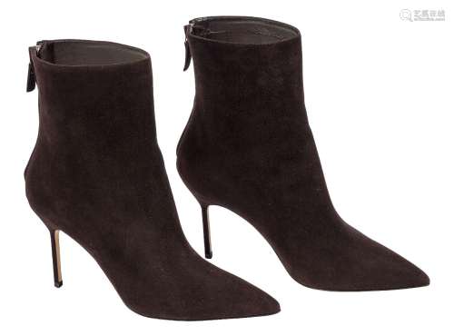 A pair of Manolo Blahnik ankle boots, designed in a dark chocolate suede, with pointed toe and