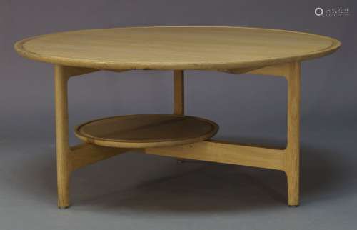 Ercol, an oak 'Svelto' coffee table, of recent manufacture, the circular top with circular