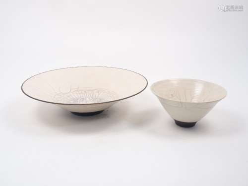 Rudi Delanghi, a raku white crackle-glazed shallow bowl on black foot, signed and dated ‘89’, 39cm