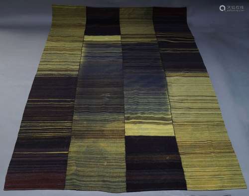 A modern flatweave wool carpet, of recent manufacture, in shades of yellow green and purple, 294cm x