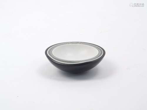 Angela Verdon, British, 1949-, A porcelain bowl of laminated alternating layers of black and