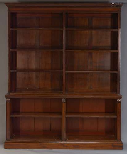 A pair of Victorian mahogany open bookcases, the moulded cornice above an arrangement of eight