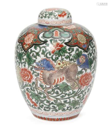 A Chinese porcelain jar and cover, 20th century, painted in wucai enamels with a mythical beast