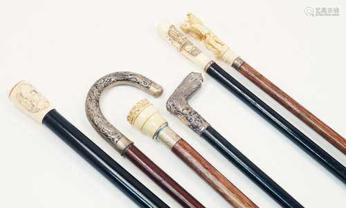 A group of Japanese/Asian canes, 20th century, one with a carved ivory figural handle and silver