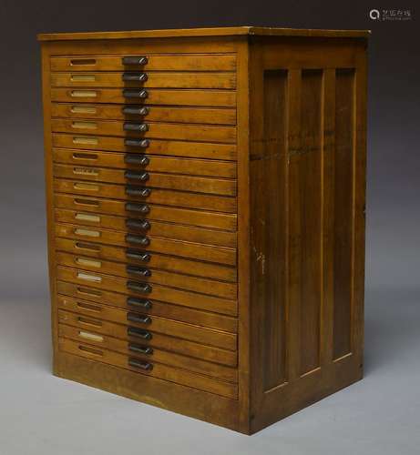 A beech plan chest, late 19th, early 20th Century, comprising twenty drawers, 124cm high, 93.5cm