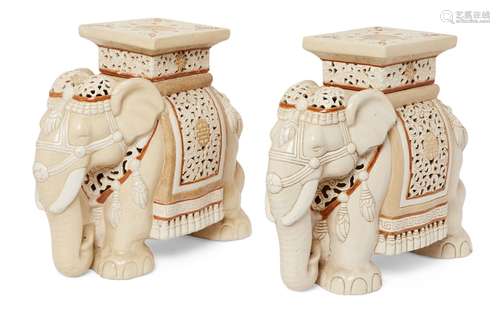 A pair of ceramic elephant form jardiniere stands, of cream ground with orange border highlights and