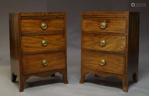 A pair of Regency style mahogany and crossbanded bedside chests, 20th Century, with brushing slide