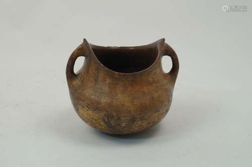 An antiquarian style terracotta vessel, of squat baluster form, with twin loop handles, pointed