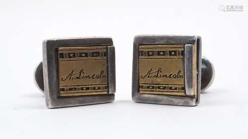 A pair of A. Lincoln cufflinks, the white metal links with yellow metal sliding panel signed 'A.