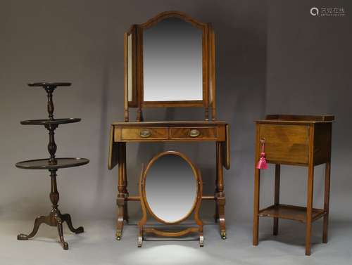 A Regency style mahogany and line inlaid sofa table, the top with two drop leaves above two frieze