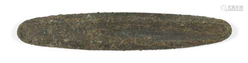 A Chinese bronze currency bar, Neolithic, of oblong form with single groove to one side, 12cm long