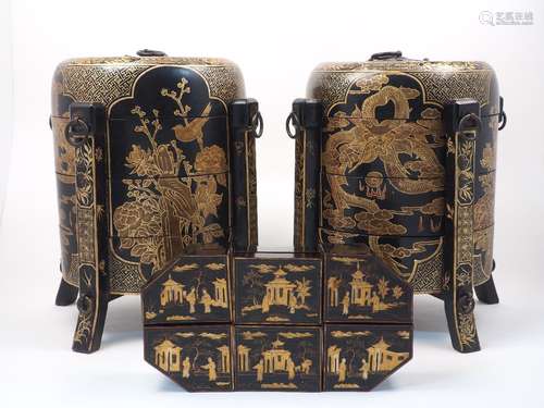 A pair Japanese black lacquer three tiered stacking boxes with domed covers, with gilt decorative