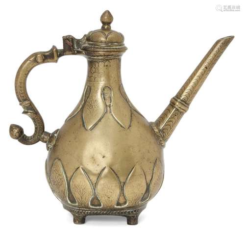 A small Mughal engraved brass lidded ewer with moulded leaf decoration, India, 18th century, of pear