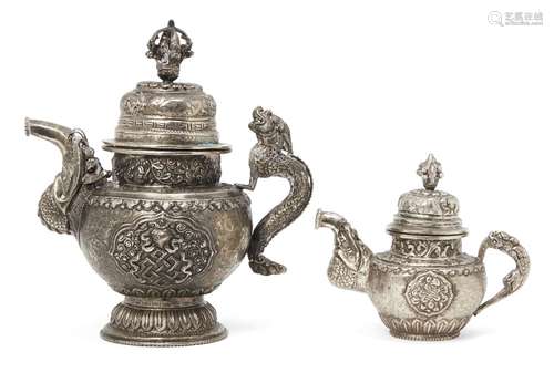 Two Tibetan white metal teapots, early 20th century, each repousse decorated with mythical beasts