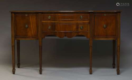 A mahogany sideboard in the Georgian taste, second half 20th Century, with two drawers, flanked by