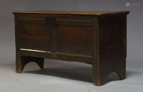 An oak coffer, early 18th Century, the hinged lid enclosing candle box and storage space, raised