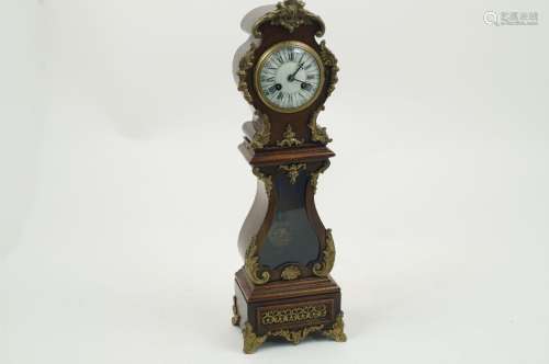 A miniature longcase clock, early 20th century, designed with waisted stem and curved hood, enamel