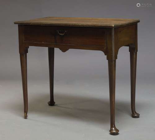 A George II mahogany side table, the rectangular top above single frieze drawer, raised on