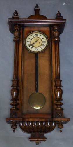 A Vienna walnut cased regulator wall clock, early 20th century, of typical form, with urn finial