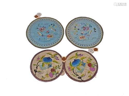 A group of four Chinese circular silk embroidered mats, 20th Century, two finely decorated with