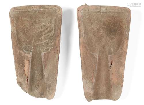 Two Chinese clay bronze moulds, Shang dynasty, probably for a farming tool, with broad tapered