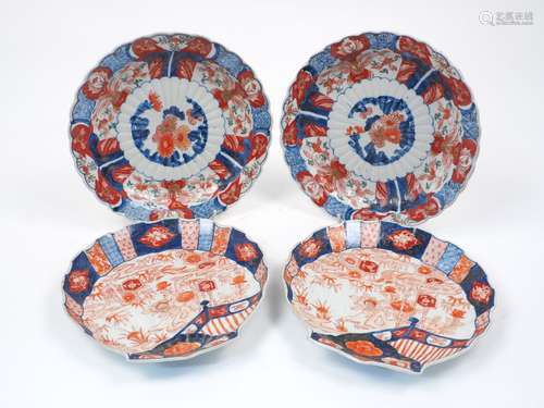 Four Japanese porcelain imari chargers, late 19th century, painted in the imari palette with