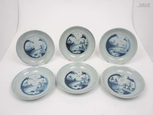 A group of six Chinese porcelain dishes, 18th century, of blue and white ground with central