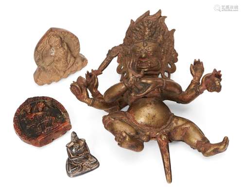 A Tibetan copper alloy figure of Mahakala, 18th/19th century, 19cm high, a silvered bronze minaiture