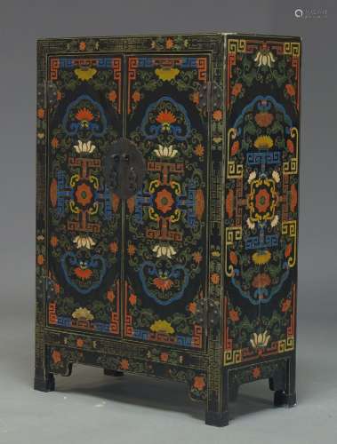 A Chinese polychrome cabinet, 20th Century, decorated with lotus flowers and geometric scrolls, with